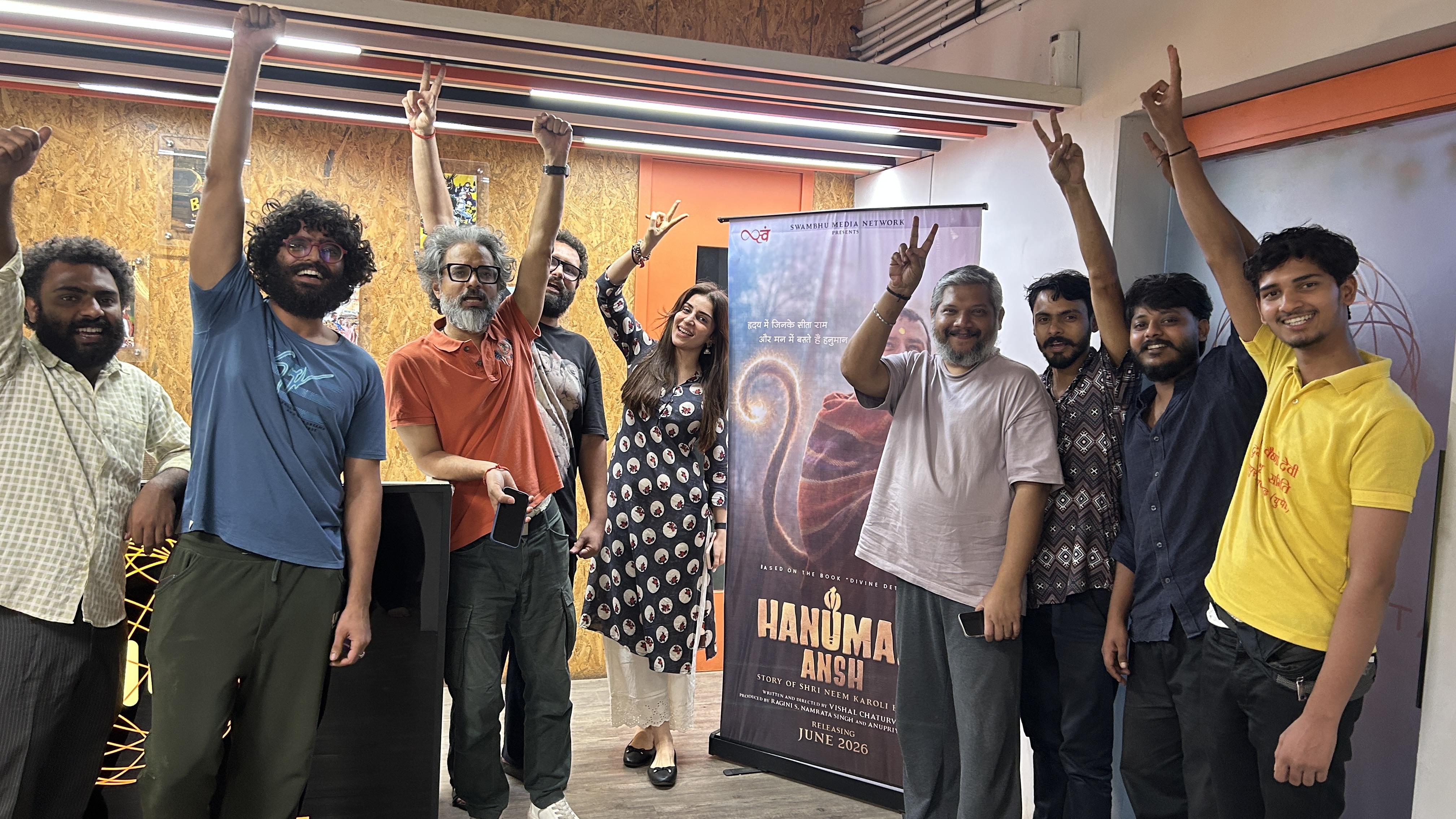 Members of the Hanuman Ansh team gathered at a recording studio